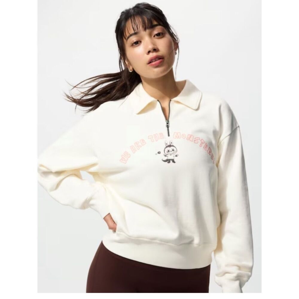 Uniqlo Cream Half-Zip Collared Sweatshirt with Pink Graphic